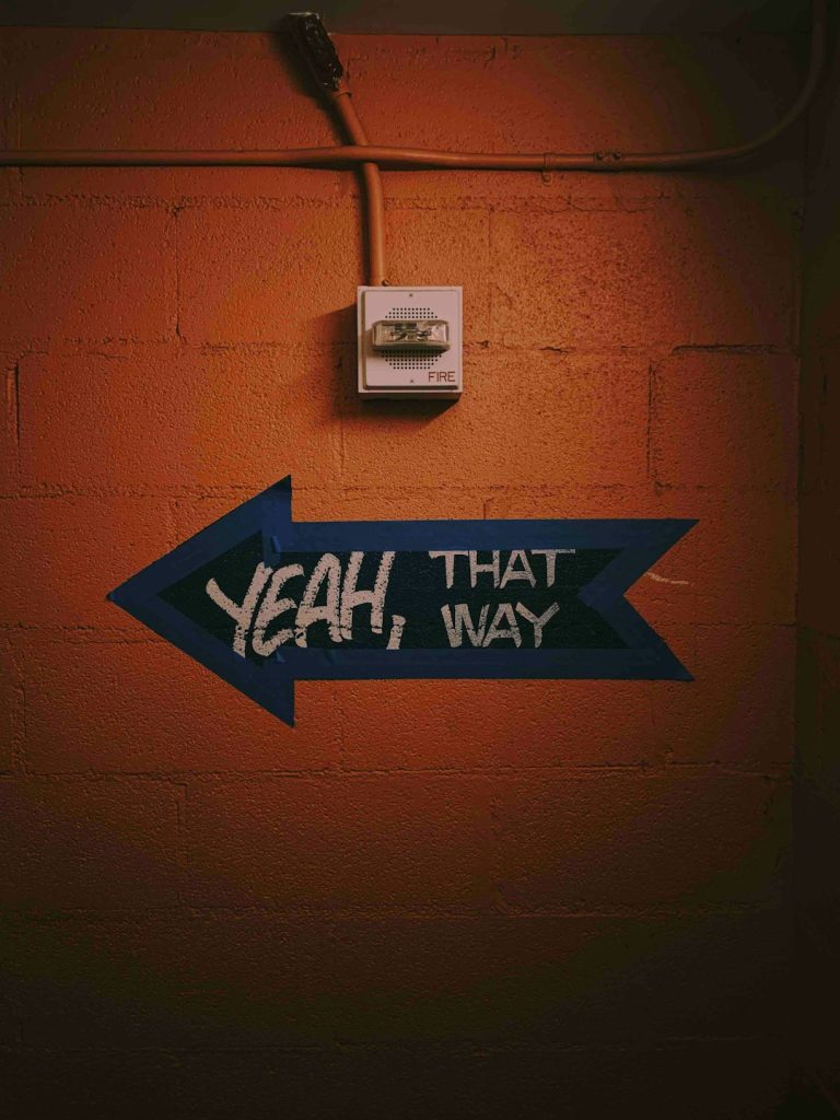 blue-and-black-arrow-signage-xcojchostu